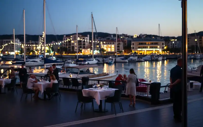 Lebhafte Nachtszene an der Limassol Marina mit Restaurants, Geschäften und Booten
